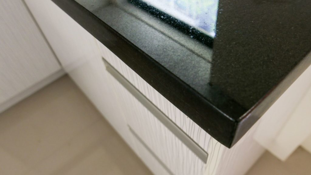 A laminated eased edge profile on an Absolute Black granite countertop