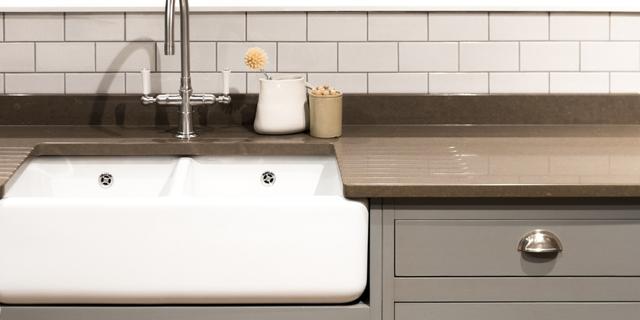 A famhouse sink style in a contemporary kitchen