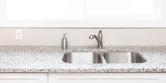 An undermount sink and a granite countertop